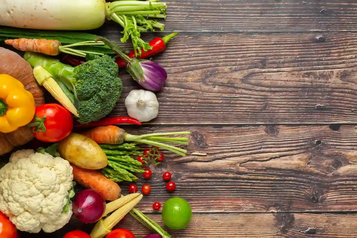 vegetables laid out on a wood backdrop